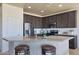 Modern kitchen featuring stainless steel appliances and an island at 16918 S 180Th Dr, Goodyear, AZ 85338