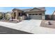Single story home with stone accents and a two car garage at 16918 S 180Th Dr, Goodyear, AZ 85338