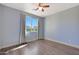 Bright bedroom with hardwood floors and ceiling fan at 16918 S 180Th Dr, Goodyear, AZ 85338
