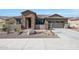 Single-story home with stone accents and a two-car garage at 16918 S 180Th Dr, Goodyear, AZ 85338