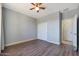 Spacious bedroom with hardwood floors and double doors leading to bathroom at 16918 S 180Th Dr, Goodyear, AZ 85338
