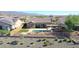 Aerial view of house with pool, backyard, and mountain views at 16918 S 180Th Dr, Goodyear, AZ 85338
