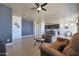 Open living room with hardwood floors, neutral walls, and views into kitchen area at 16918 S 180Th Dr, Goodyear, AZ 85338