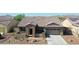 Single story home with tile roof and two car garage at 16918 S 180Th Dr, Goodyear, AZ 85338
