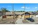 Single-story home with a two-car garage, pool, and solar panels at 15402 N 56Th Ave, Glendale, AZ 85306