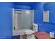Clean bathroom with shower/tub combo and blue walls at 15402 N 56Th Ave, Glendale, AZ 85306