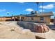 Relaxing pool area with flagstone decking and a rock feature at 15402 N 56Th Ave, Glendale, AZ 85306