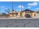 Single-story home with a two-car garage and desert landscaping at 15402 N 56Th Ave, Glendale, AZ 85306