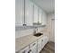 Modern kitchen featuring white cabinets, quartz countertops, and subway tile backsplash at 2617 W Osborn Rd, Phoenix, AZ 85017