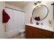 Bathroom with shower/tub combo and wood vanity at 7575 E Indian Bend Rd # 2013, Scottsdale, AZ 85250