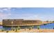 Community entrance with stone wall and water feature at 46963 W Coe St, Maricopa, AZ 85139