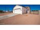 New construction home featuring a large garage and a side gate at 10530 E Baltimore St, Apache Junction, AZ 85120