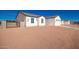 Newly constructed home with a gravel driveway and a gated entry at 10530 E Baltimore St, Apache Junction, AZ 85120