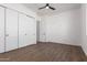 Bedroom with white doors and wood-look floors at 10530 E Baltimore St, Apache Junction, AZ 85120