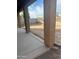 Covered patio overlooks a spacious backyard with grassy area at 9406 W Elwood St, Tolleson, AZ 85353