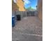 Small gravel area with a gate, providing additional outdoor space at 9406 W Elwood St, Tolleson, AZ 85353