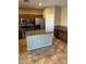 Kitchen boasts granite countertops and stainless steel appliances at 9406 W Elwood St, Tolleson, AZ 85353