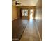 Living room with laminate wood flooring and access to backyard at 9406 W Elwood St, Tolleson, AZ 85353