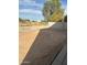 Large backyard with dirt and small gravel areas at 9406 W Elwood St, Tolleson, AZ 85353