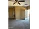 Bedroom with carpet, ceiling fan, and access to balcony at 9406 W Elwood St, Tolleson, AZ 85353