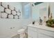 Clean powder room with a modern vanity and toilet at 947 W Saddle Run, Apache Junction, AZ 85120