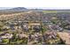 Aerial perspective of a residential area featuring sizable homes and a mountain backdrop at 2300 E Sanoque Ct, Gilbert, AZ 85298