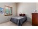 Cozy bedroom with a comfortable bed and a window at 2300 E Sanoque Ct, Gilbert, AZ 85298