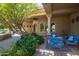 Relaxing outdoor patio area with seating and a fountain at 2300 E Sanoque Ct, Gilbert, AZ 85298