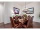 Formal dining room featuring a large table and leather chairs at 2300 E Sanoque Ct, Gilbert, AZ 85298