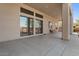 Covered patio with sliding glass doors leading to the backyard at 36908 N 19Th St, Phoenix, AZ 85086