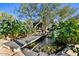 Relaxing Koi pond with a wooden footbridge at 36908 N 19Th St, Phoenix, AZ 85086