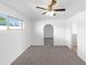 Spacious bedroom with arched doorway and neutral decor at 4521 N 15Th Ave, Phoenix, AZ 85015