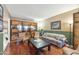 Living room with hardwood floors, comfortable seating, and built-in shelving at 7528 E Corrine Rd, Scottsdale, AZ 85260