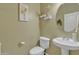 Small bathroom with pedestal sink and toilet at 12315 N Chama Dr # 102, Fountain Hills, AZ 85268