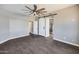 Spacious bedroom with ceiling fan and wood-look tile flooring at 20382 N 53Rd Ave, Glendale, AZ 85308