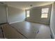 Well-lit bedroom with two windows and tile flooring at 22864 E Roundup Way, Queen Creek, AZ 85142