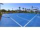 Blue basketball court with a hoop and surrounding community amenities at 13567 N 142Nd Ave, Surprise, AZ 85379