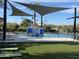 Community pool with splash pad and shade structures at 13567 N 142Nd Ave, Surprise, AZ 85379