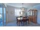 Bright dining area features a wooden table with four chairs at 13567 N 142Nd Ave, Surprise, AZ 85379