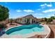 Home with a refreshing blue pool, spacious backyard, and solar panels on the roof at 1178 E Betsy Ln, Gilbert, AZ 85296