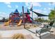 playground with play structures and shaded seating at 8454 W Mantle Way, Florence, AZ 85132