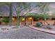 Single story home with brick walkway, desert landscaping, and warm-toned exterior at 985 W America St, Wickenburg, AZ 85390