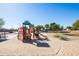 Modern playground with climbing structures and slides at 22971 W La Pasada Blvd, Buckeye, AZ 85326