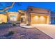 House exterior with two-car garage and desert landscaping at 7082 E Palo Brea Dr, Gold Canyon, AZ 85118