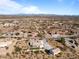 Aerial view showcasing a neighborhood with desert landscape at 2995 W Pinto Pl, Wickenburg, AZ 85390