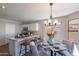 Modern kitchen island with seating for three, granite countertop at 2222 E Arabian Dr, Gilbert, AZ 85296