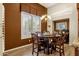 Bright dining room with wood table and chairs, offering ample natural light at 15439 E Acacia Way, Fountain Hills, AZ 85268