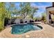 Enjoy this relaxing kidney shaped pool with surrounding patio at 15439 E Acacia Way, Fountain Hills, AZ 85268