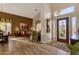 Spacious living room with hardwood floors, a leather couch, and large windows at 15439 E Acacia Way, Fountain Hills, AZ 85268