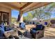 Relaxing covered patio with seating area, adjacent to a refreshing pool at 15439 E Acacia Way, Fountain Hills, AZ 85268